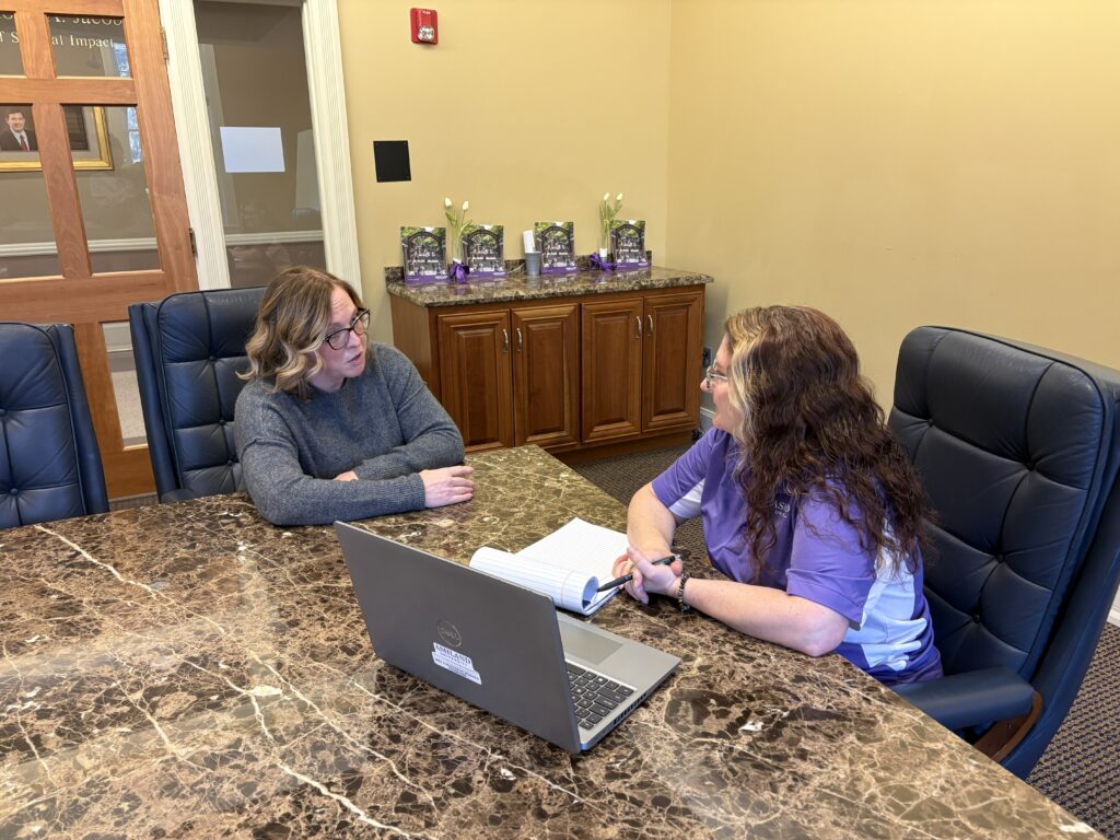 An SBDC advisor working one-on-one with a client at the Ashland office